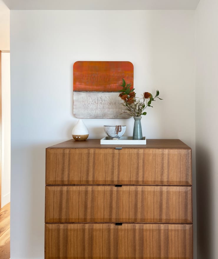 Amy Van Winkle orange and white abstract square painting in client home, purchased through Kennedy Contemporary art gallery