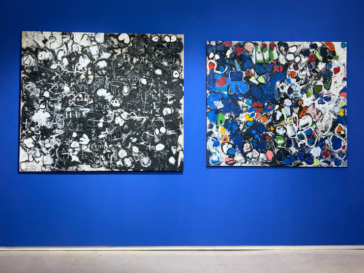 Installation View of Taher Jaoui's works on a blue wall at 1-54 Marrakech 2025 on the booth of GALERIE FARAH FAKHRI