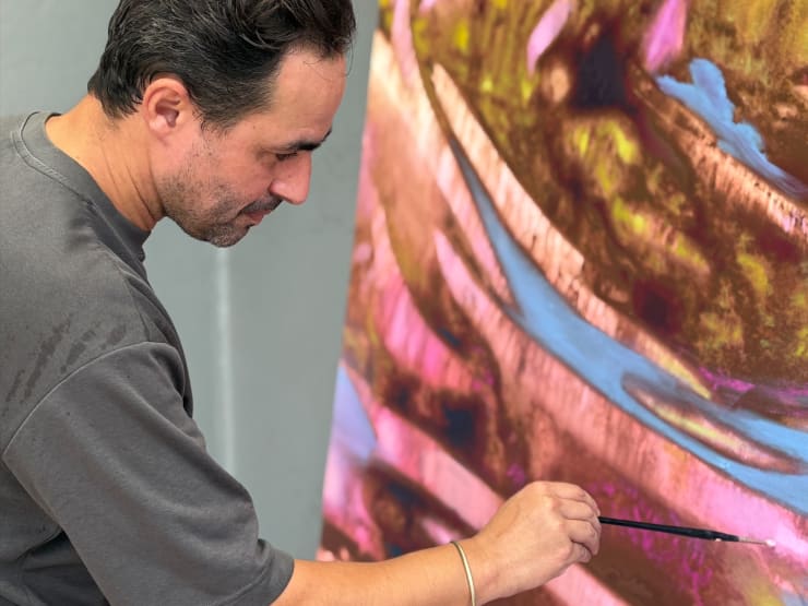 Béchir Boussandel working on a canvas at GALERIE FARAH FAKHRI's residency in Abidjan