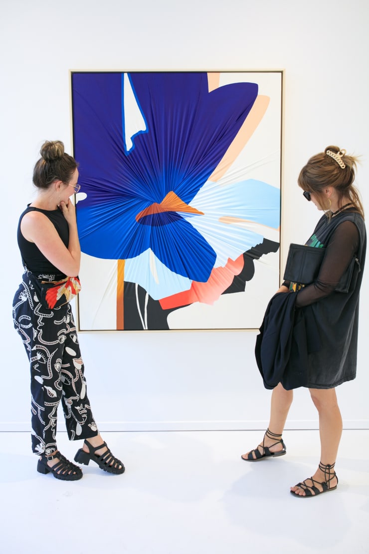 Dopamine installation view with guests featuring an original work by Carrie Gillen