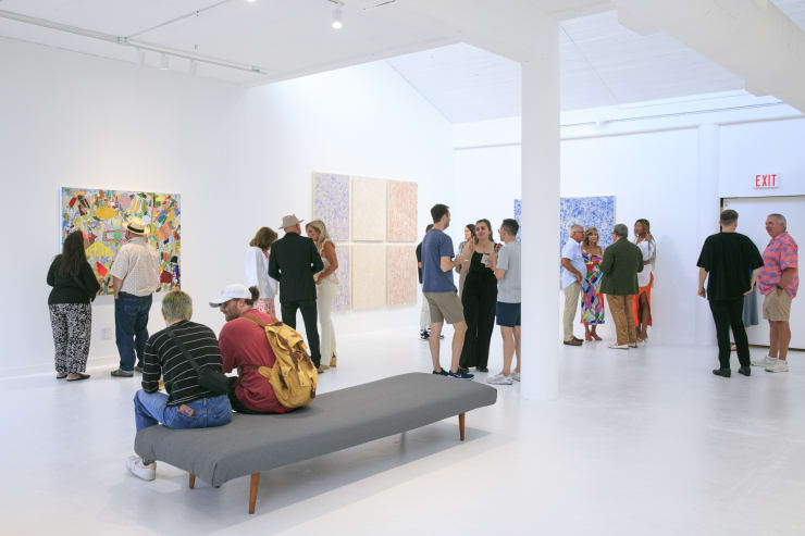 Guests at the opening reception of "Tiger Moth", a solo exhibition by Sarah Giannobile. Photo by Suzy Gorman