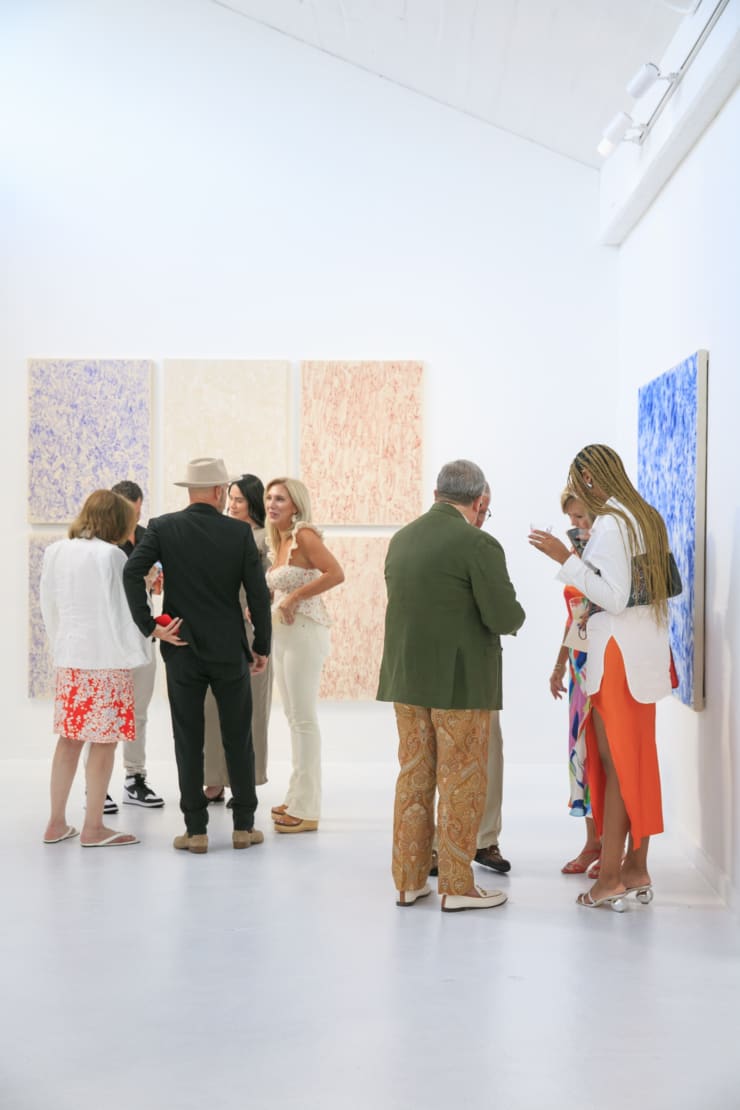 Guests at the opening reception of "Tiger Moth", a solo exhibition by Sarah Giannobile. Photo by Suzy Gorman