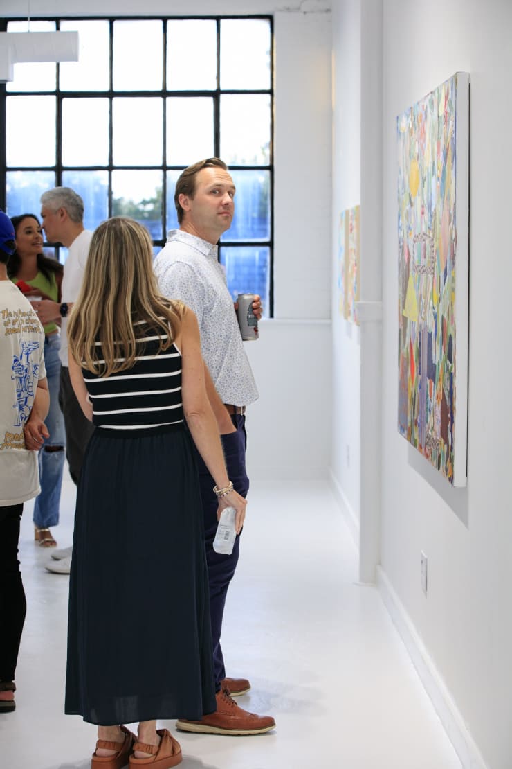 Guests at the opening reception of "Tiger Moth", a solo exhibition by Sarah Giannobile. Photo by Suzy Gorman