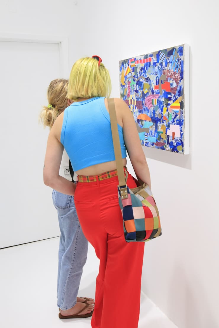 Guests at the opening reception of "Tiger Moth", a solo exhibition by Sarah Giannobile. Photo by Suzy Gorman