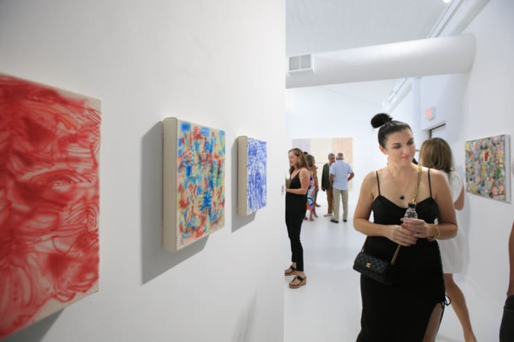 Guests at the opening reception of "Tiger Moth", a solo exhibition by Sarah Giannobile. Photo by Suzy Gorman