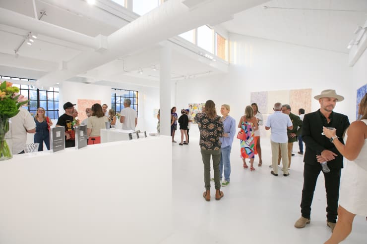 Guests at the opening reception of "Tiger Moth", a solo exhibition by Sarah Giannobile. Photo by Suzy Gorman