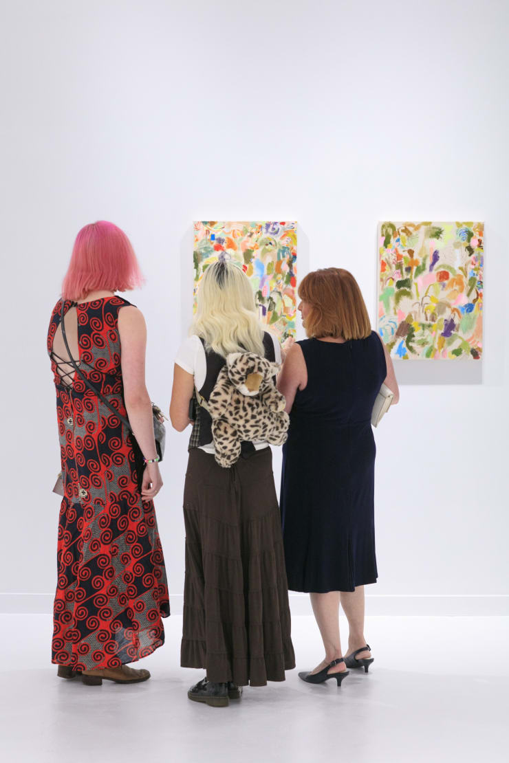 Guests at the opening reception of "Tiger Moth", a solo exhibition by Sarah Giannobile. Photo by Suzy Gorman