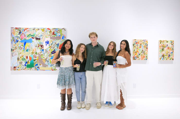 Guests at the opening reception of "Tiger Moth", a solo exhibition by Sarah Giannobile. Photo by Suzy Gorman