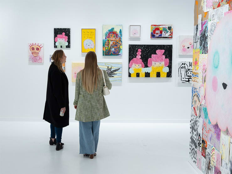 Guests at Adam Handler's "Eagle King" exhibition opening reception