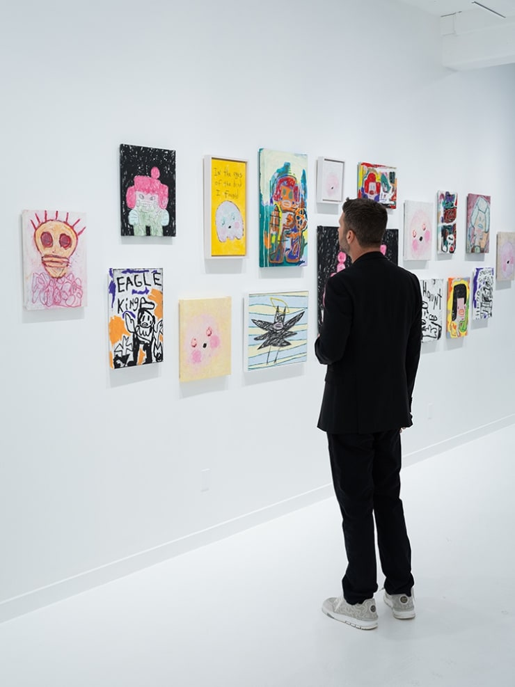 Guests at Adam Handler's "Eagle King" exhibition opening reception