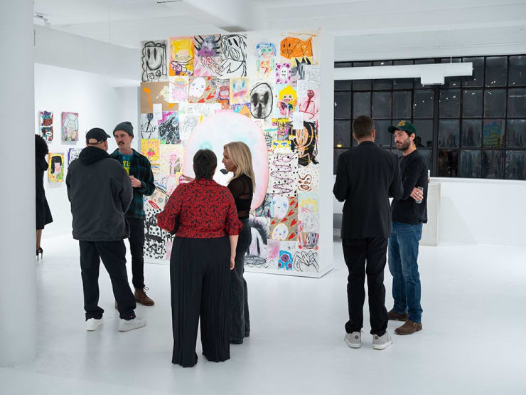 Guests at Adam Handler's "Eagle King" exhibition opening reception