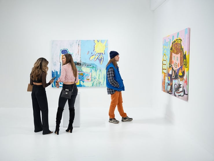Guests at Adam Handler's "Eagle King" exhibition opening reception