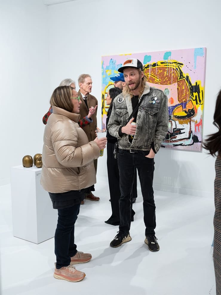 Guests at Adam Handler's "Eagle King" exhibition opening reception