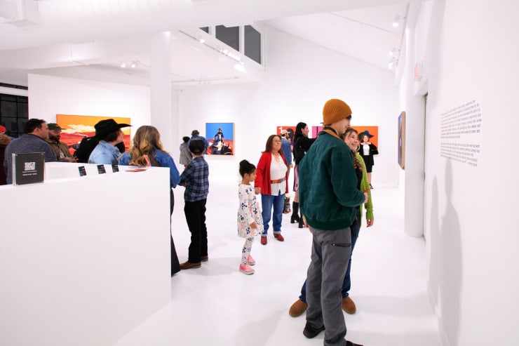 Guests at Jeremy Booth's solo exhibition "Sweat & Blood" opening reception