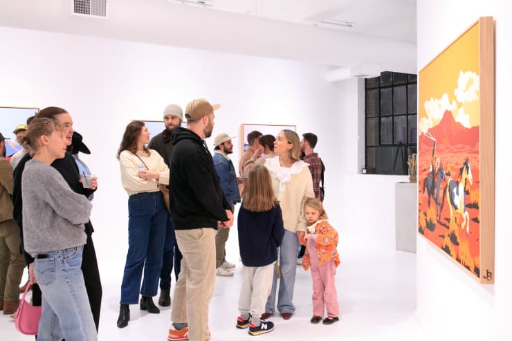Guests at Jeremy Booth's solo exhibition "Sweat & Blood" opening reception
