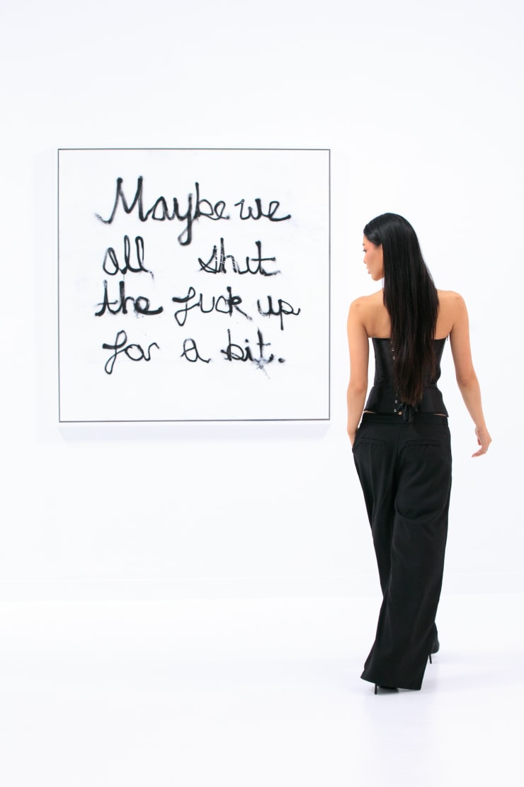 Guest with Sage Barnes artwork "Maybe" (2025) at "Frame of Mind" opening reception