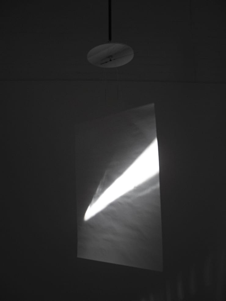 Guy Sherwin Clock Screen #2, 2015 (2007) Installation for 16mm projector, mirror, clock, paper screen, 2 minute film loop (GSN006)