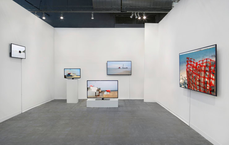 Art fair booth with five TV screens playing colorful abstract video art of seascapes by peter campus.