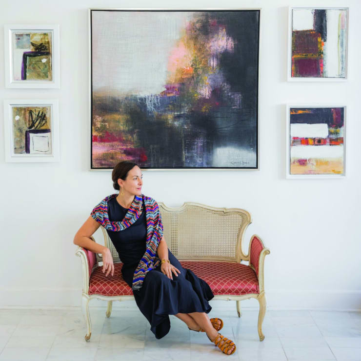 Carla Groh, photographed in front of works by Carlos Llanes, in her Palm Beach gallery, Evey Fine Art.
