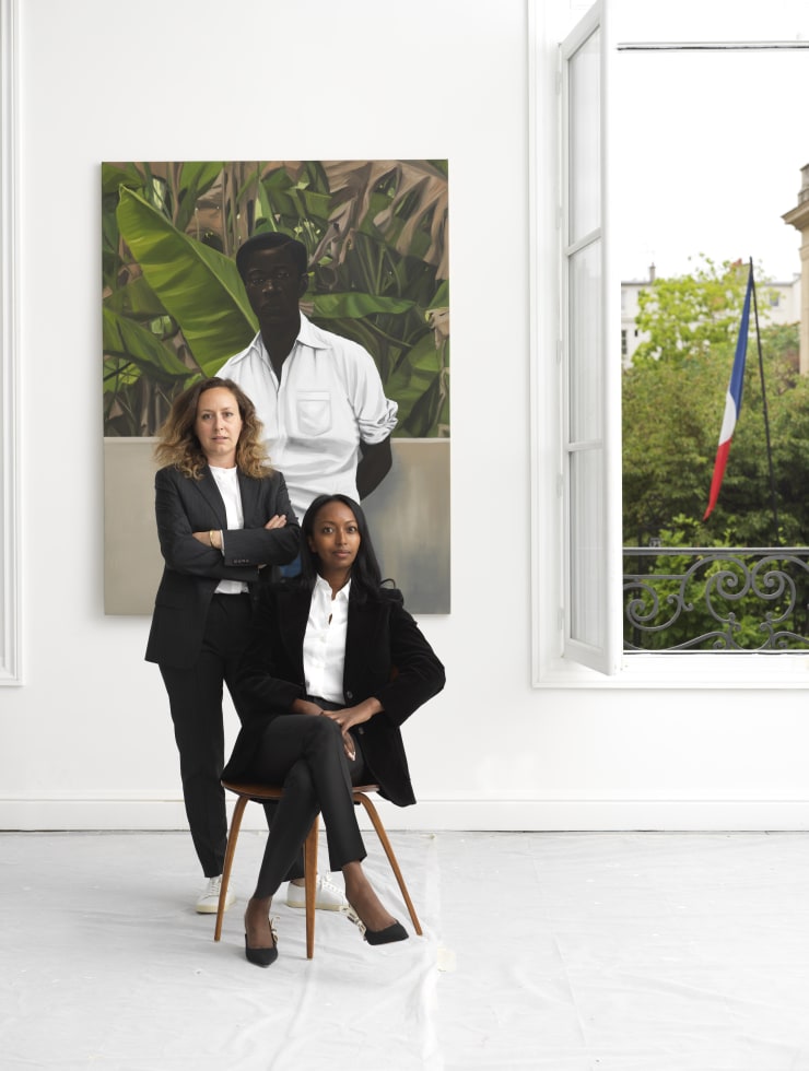 Laura Turcan and Mariane Ibrahim. Photo by Fabrice Gousset. Courtesy of Mariane Ibrahim. Artwork: Peter Uka, Tall Long John, 2021. Courtesy of Mariane Ibrahim.