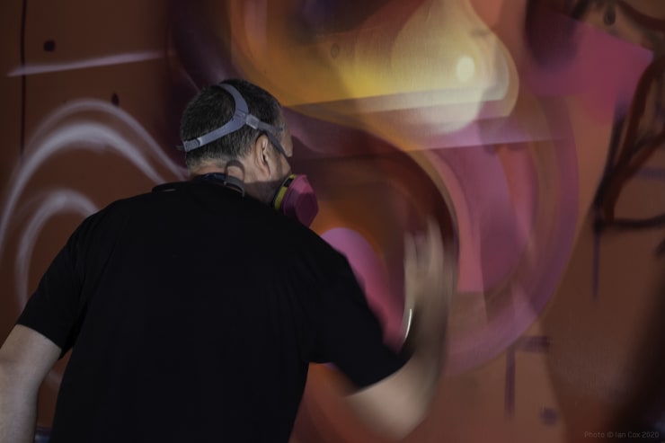 Mr. Cenz creating artworks in the hallway of the Victorian town house for disCONNECT (2020). Photo: Ian Cox.