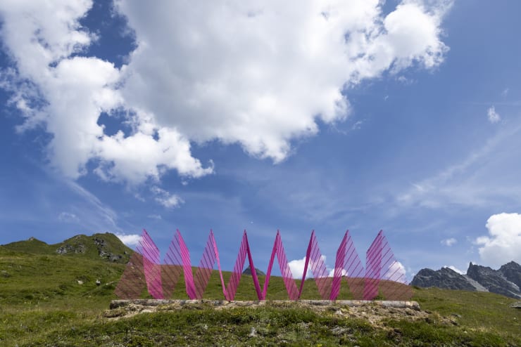 Installation views: Rana Begum and Steve Webb, No.1387 Fence, 2024, Powder-coated fencing, local wooden logs, Verbier 3-D Foundation Sculpture Park.