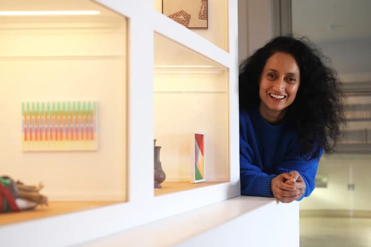 Begum with a previous artwork in Pallant House Gallery’s 2021 Model Art Gallery. Photo credit Sam Stephenson