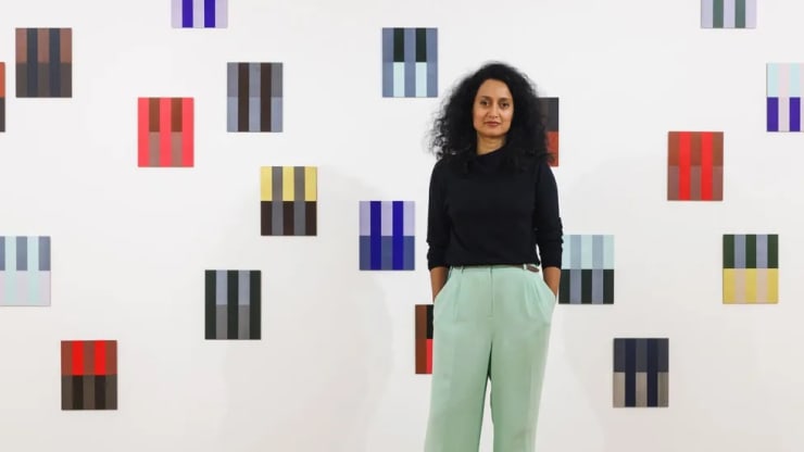 Rana Begum in front of one of her artworks at St Albans Museum + Gallery