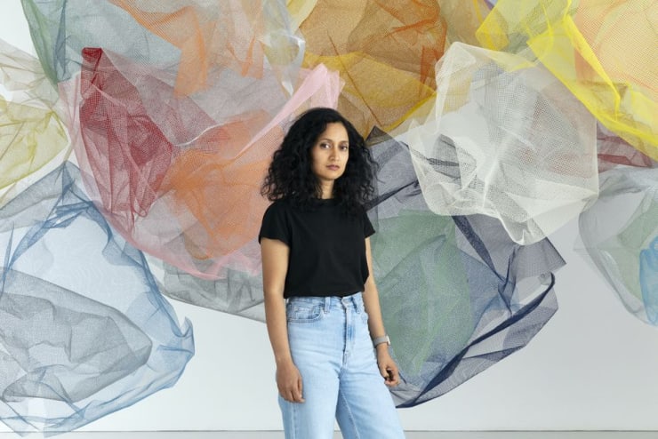 Rana Begum in front of 'No. 1081 MESH' 2021. © Begum Studio Photography: Angus Mill