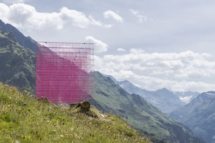 Installation views: Rana Begum and Steve Webb, No.1387 Fence, 2024, Powder-coated fencing, local wooden logs, Verbier 3-D Foundation Sculpture Park.