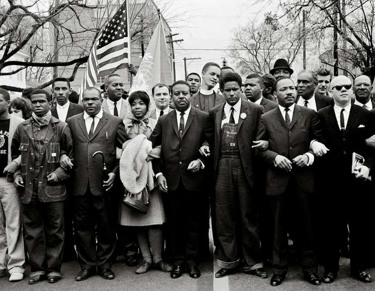 Steve Schapiro - Steve Schapiro Martin Luther King Jr. and Group Enter Montgomery, Black Suits, 1965 Signed, titled, dated, and editioned verso 16 x 20 inch silver gelatin print Edition of 25 30 x 40 inch silver gelatin print Edition of 12