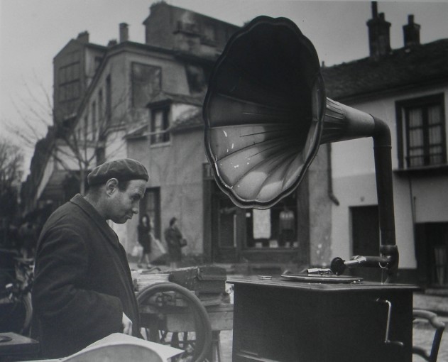 <span class="title">Man at Flea Market with Vinyl Player, France<span class="title_comma">, </span></span><span class="year">c.1950</span>