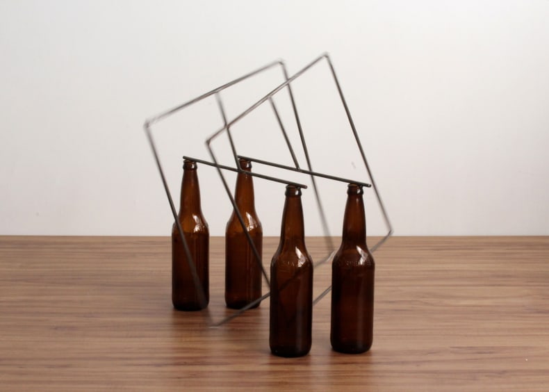 Raul Mourão 4 garrafas, 2017 aço 1020 com resina sintética e garrafas de vidro 46 x 44 x 44 cm