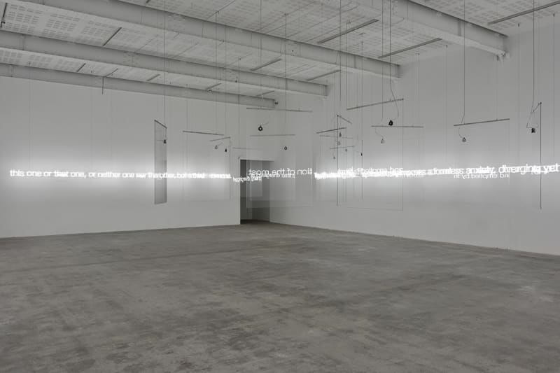 Cerith Wyn Evans Composition in Panes (on Reflection), 2017 15 low-iron glass panels mounted on a stainless steel frame; 15...