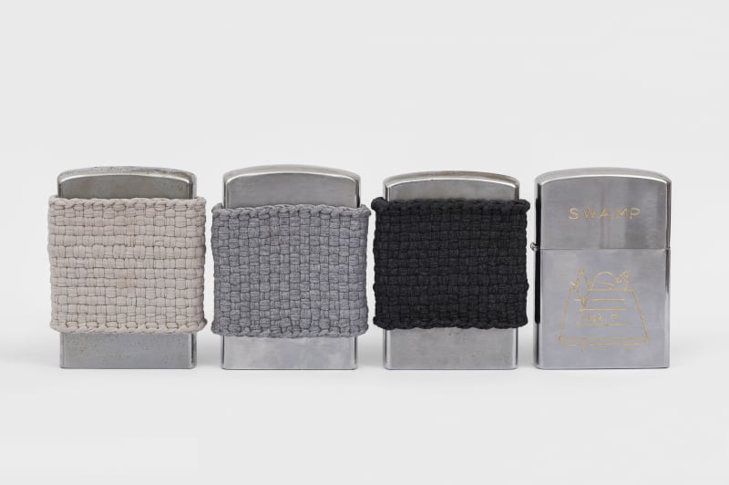 An-My Lê Swamp, Fuck it, 2021 4 vintage lighters, cotton yarn 6 1/2 x 17 x 1 1/2 in. (16.5...