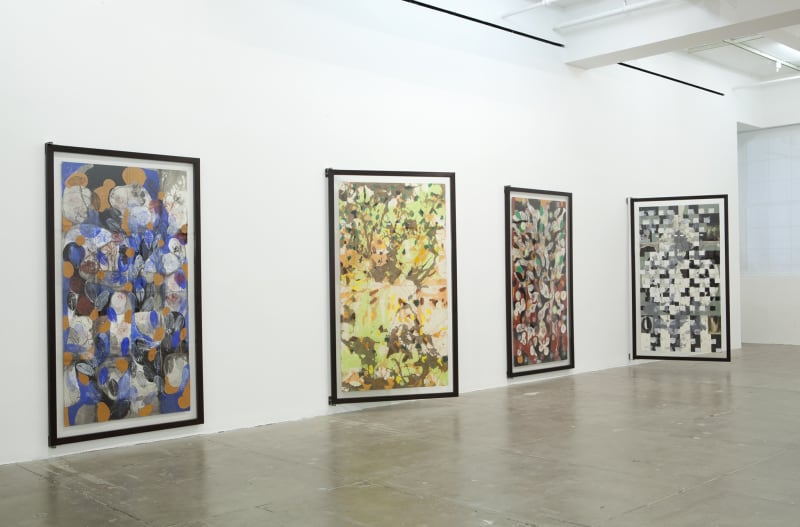 Four large paintings of abstract shapes and various colors are displayed on hinges to view the front and back. 