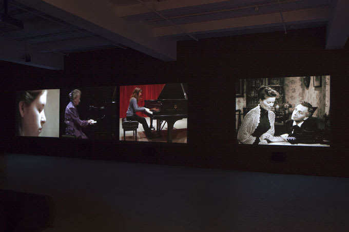 4-channel video installation, one of a closeup of a girl, two of women at the piano, and the last of Katherine Hepburn with Paul Henreid.