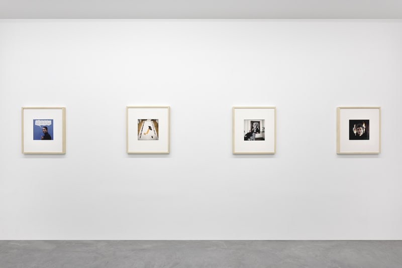 4 framed artworks hang in a gallery.