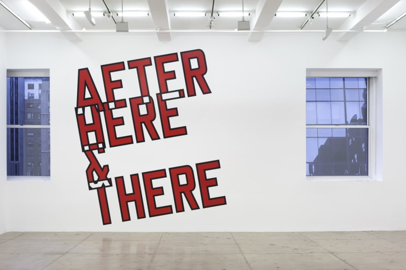 Maroon text with a black outline on wall reading "AFTER HERE & THERE"