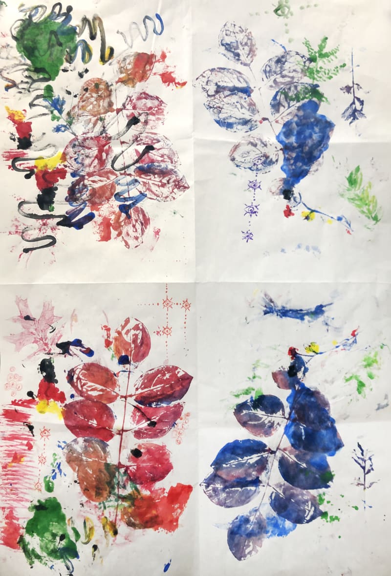 A colorful abstract painting utilizing prints of leaves