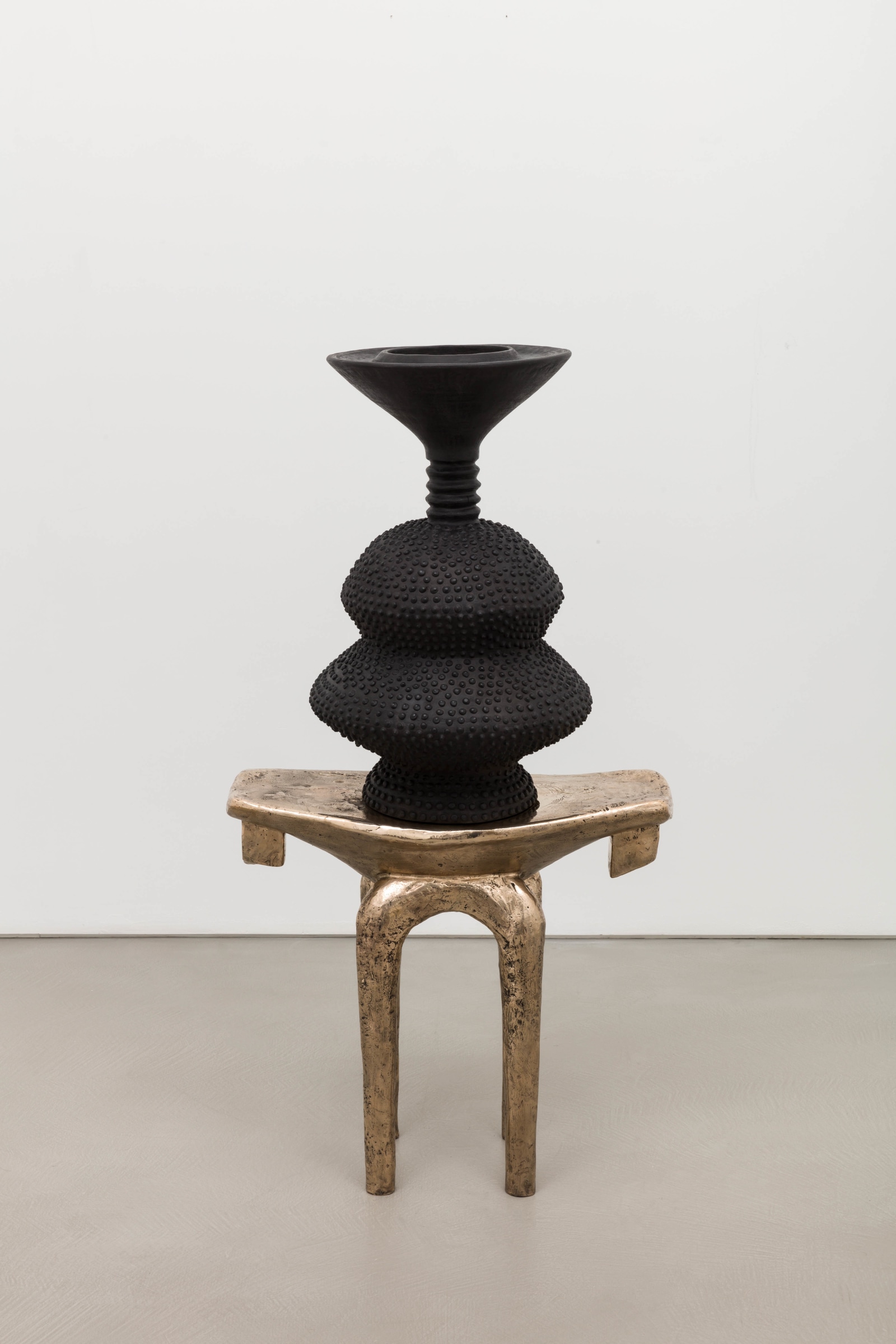 Lina Iris Viktor, black eclipse on golden stool, 2024