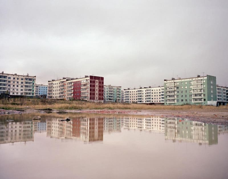 Simon Roberts Apartment blocks reflected in water, Sakhalin Island, Far East Russia, 2004