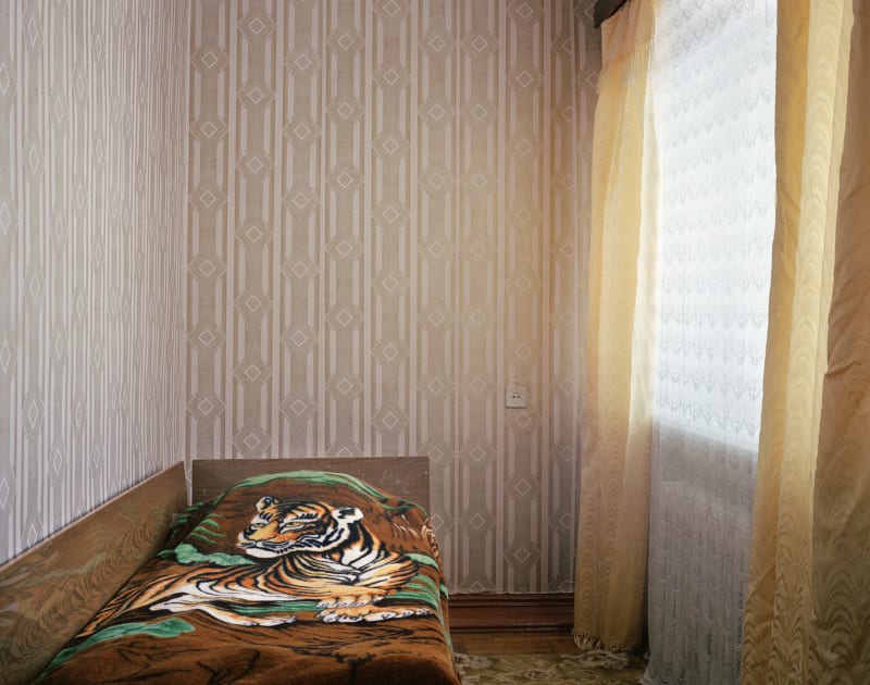 Simon Roberts Tiger print bedspread in the Druzhba hotel, Kyakhta, Eastern Siberia, 2004