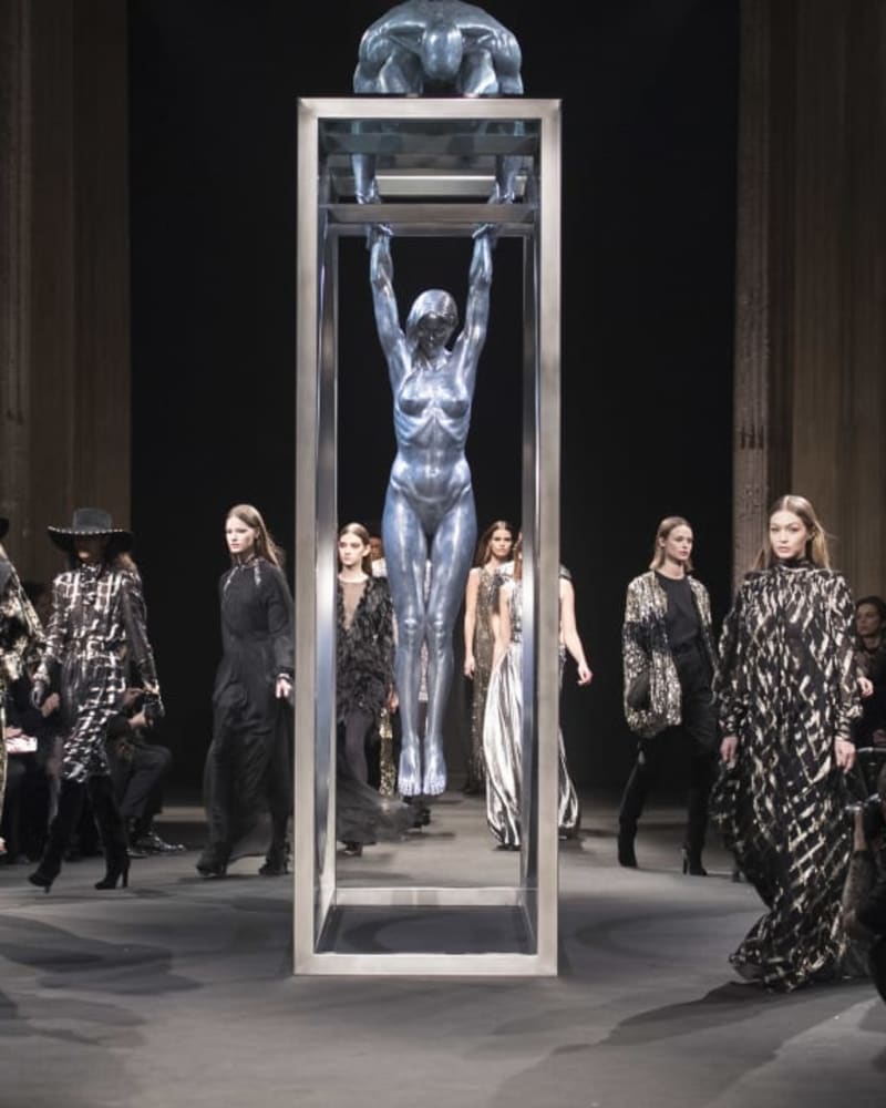 Lorenzo Quinn’s ‘Gravity’ in the centre of the runway at Milan Fashion Week