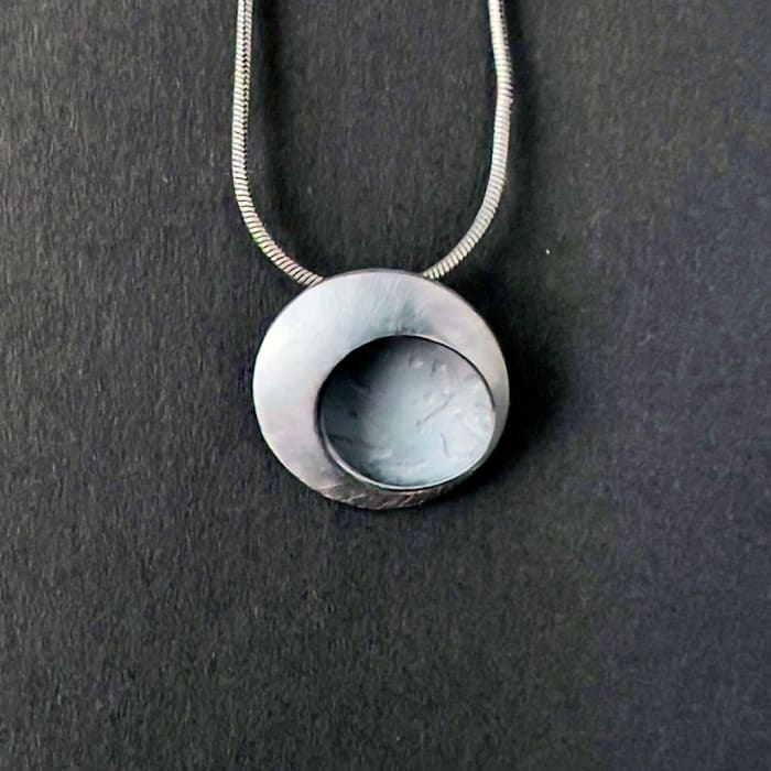 Hannah Souter, Tiny oxidised etch pendant , 2024
