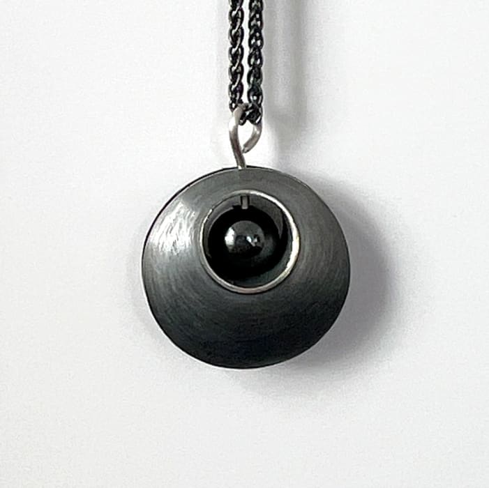 Hannah Souter, Oxidised and heamatite pendant, 2024