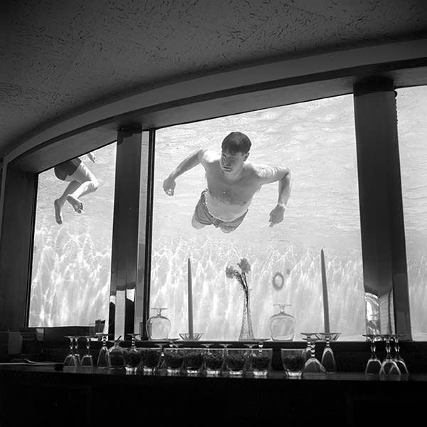 Vivian Maier, Untitled (Man swimming in bar) n.d.