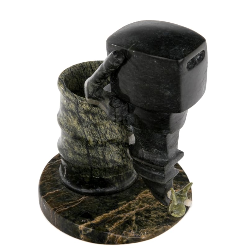 JAMASEE PITSEOLAK (1968-) KINNGAIT (CAPE DORSET)  Servicing an Outboard Motor on a Barrel, 2000s  stone and antler, 4.25 x 3.5 x 3 in (10.8 x 8.9 x 7.6 cm)  unsigned.
