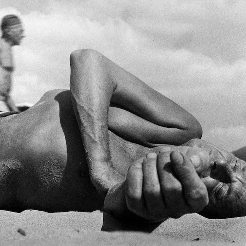 Leon Levinstein, Coney Island (old man lying in sand), c.1955