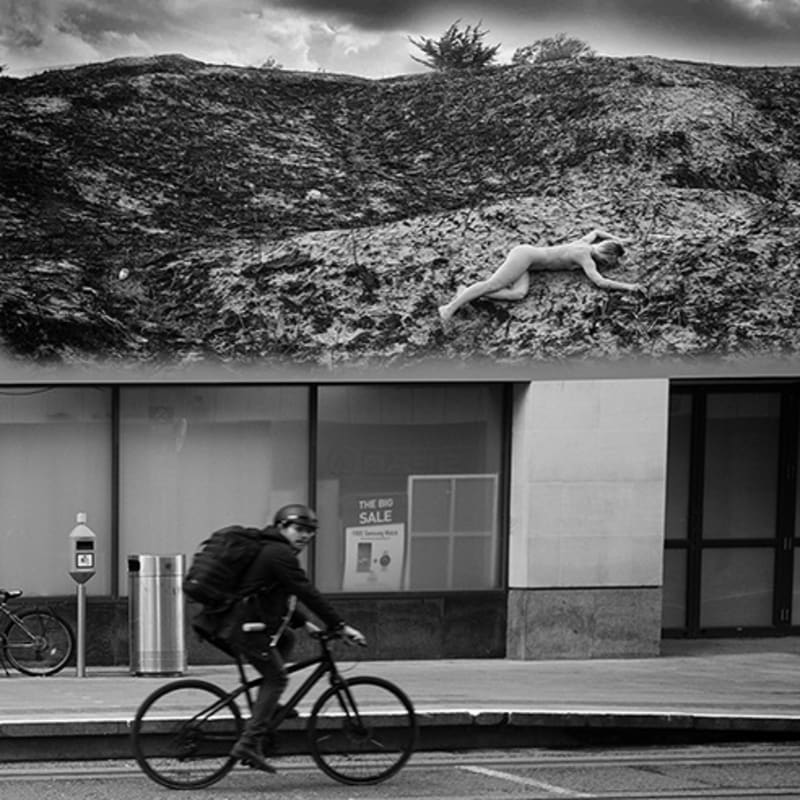 <p>During the Covid - 19 First Lockdown in Dublin City, Ireland. A man cycles past a virtual image on an advertising billboard.</p><p>Images from Eamonn Farrell's The Naked City Virtual Exhibition for Dublin Culture Night 2020.</p>